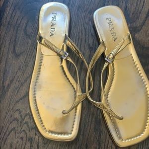 Prada gold flip flops